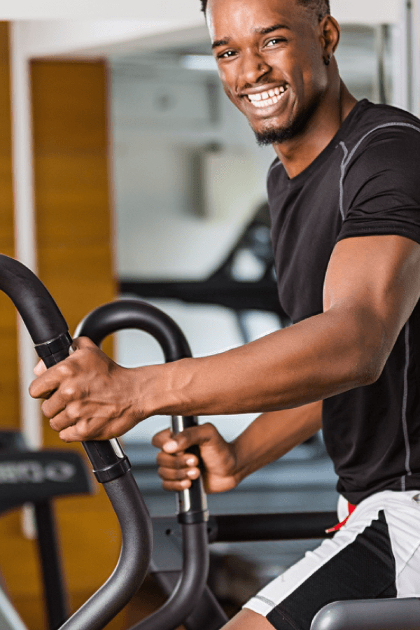 Resident training inside The Kharis on-site fitness centre